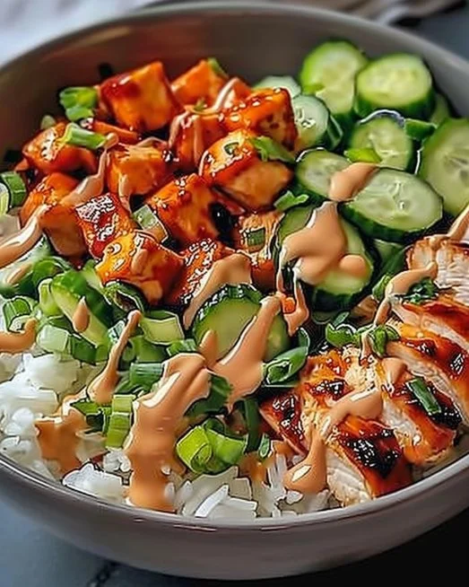 Bang Bang Chicken Bowl 2 Bang Bang Chicken Bowl featuring spicy chicken over rice with vegetables