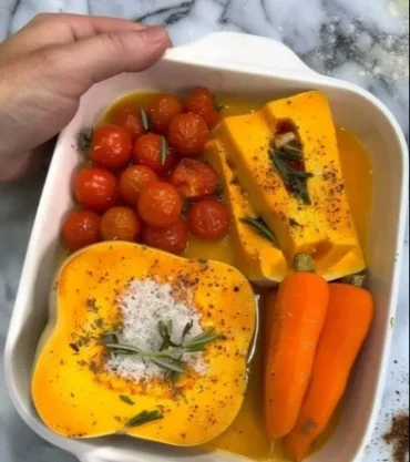 Creamy roasted butternut squash soup served in a bowl with garnish.