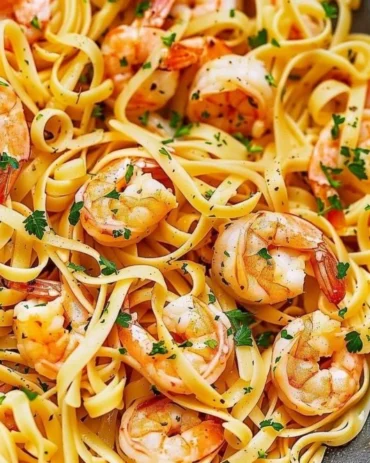 Delicious Garlic Butter Shrimp Pasta served in a bowl with parsley and chili flakes