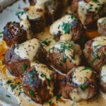 Delicious Garlic Butter Steak Bites with Parmesan Cream Sauce plated beautifully