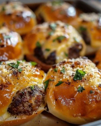 Garlic Parmesan Cheeseburger Bombs 2 Garlic Parmesan Cheeseburger Bombs fresh out of the oven, golden and cheesy.