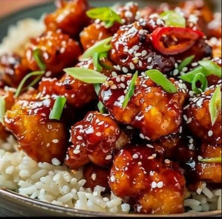 Sweet Chili Chicken 2 Delicious plate of Sweet Chili Chicken garnished with fresh herbs